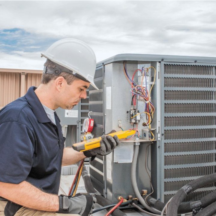 The Blue Mountains Heating & Cooling HVAC technician on a service call in The Blue Mountains, Ontario